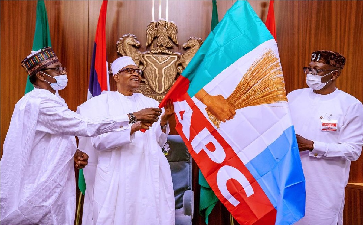 Buhari hands over flag to Ize-Iyamu